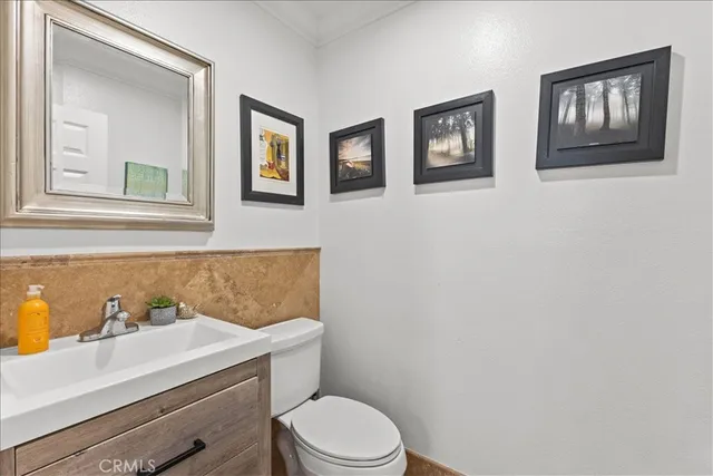 an aerial view of a house with swimming pool and patio