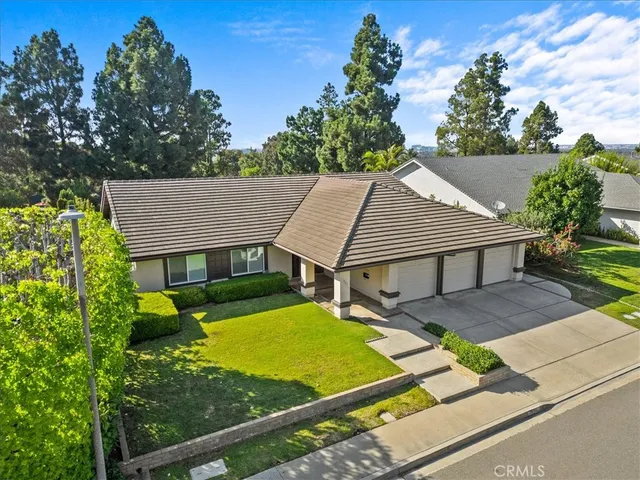 a view of a patio with table and chairs next to a yard