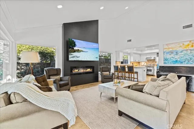 a view of a dining room with furniture and a potted plant