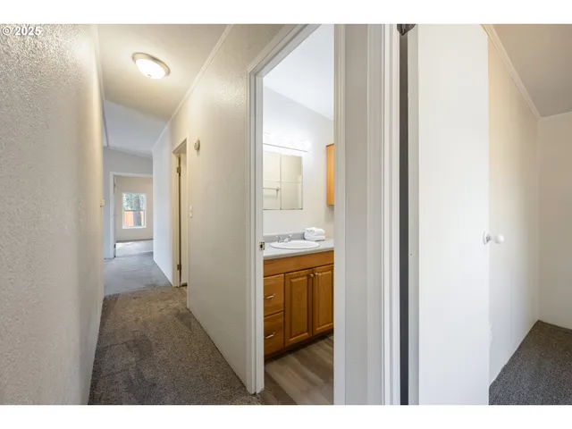 a view of a bathroom from a hallway