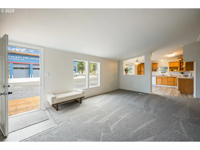 a view of an empty room and a window