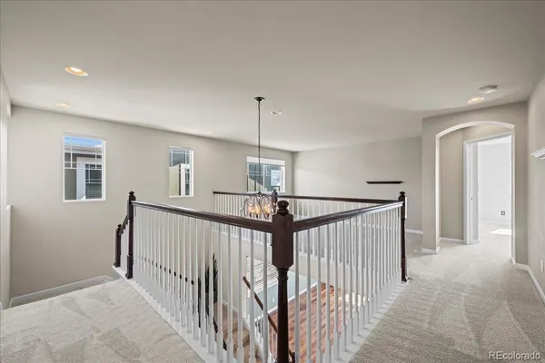 a view of a hallway with windows
