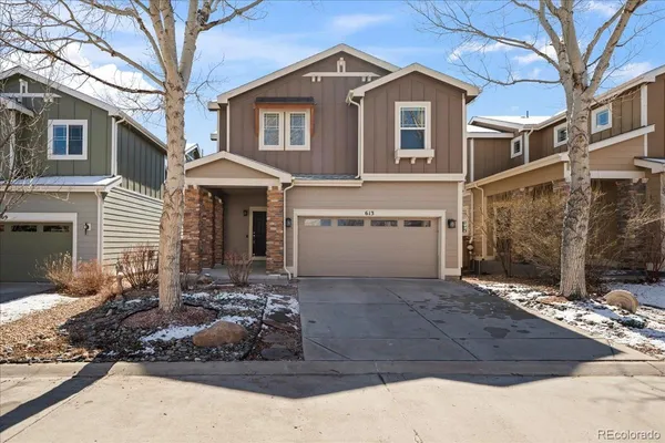 a front view of a house with yard