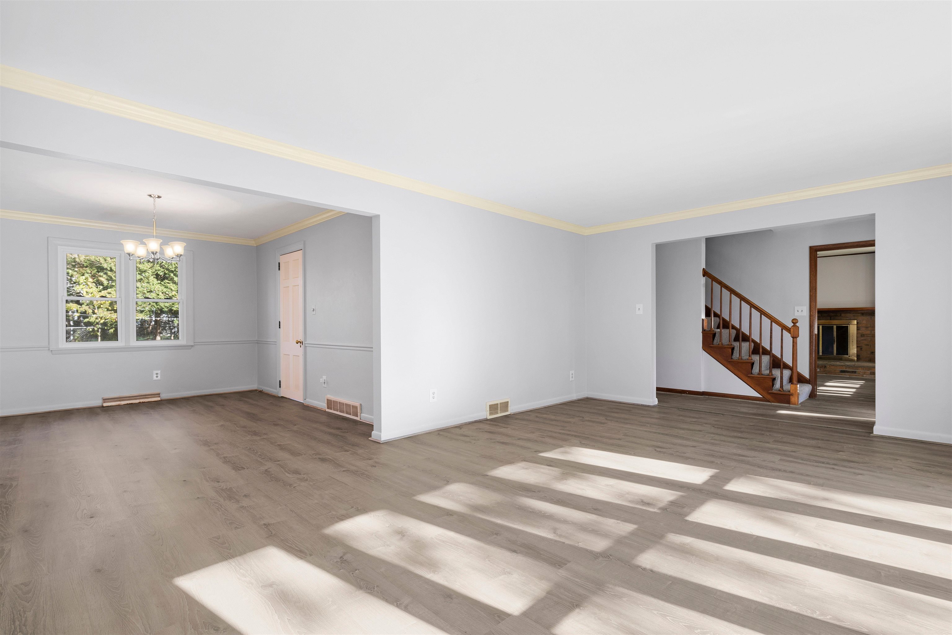 4962 Braewild Road Rockford, IL 61107 - Photo 2 of 20 a view of an empty room with wooden floor and a window