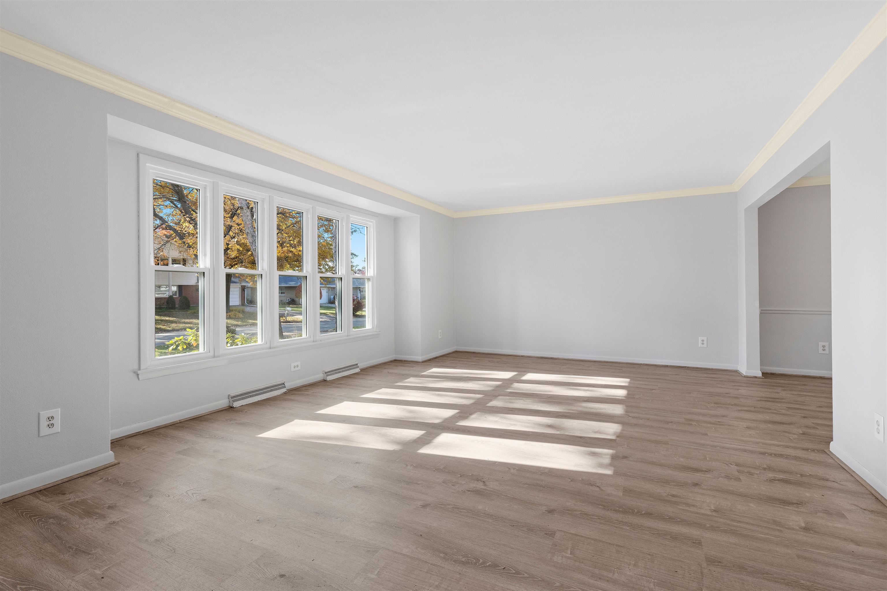 4962 Braewild Road Rockford, IL 61107 - Photo 3 of 20 a view of empty room with wooden floor and fan