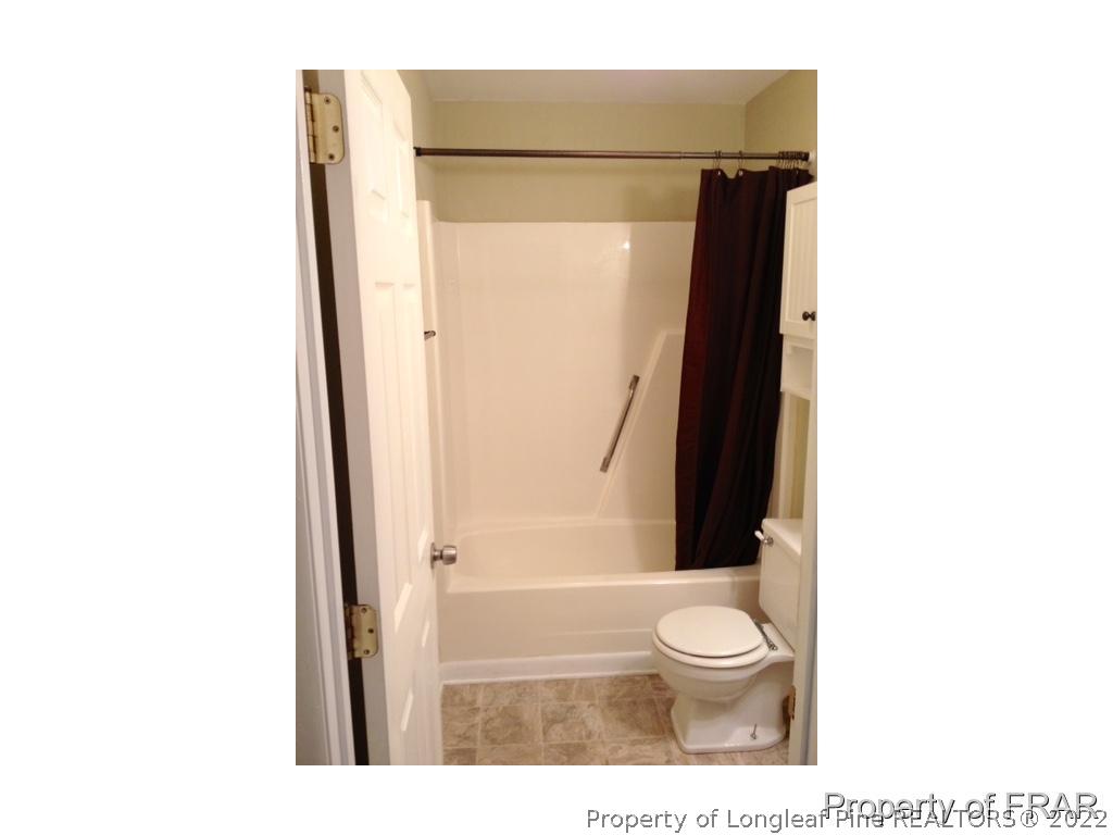 1786 Arrow Ridge Way Fayetteville, NC 28304 - Photo 12 of 17 a bathroom with a toilet and a shower