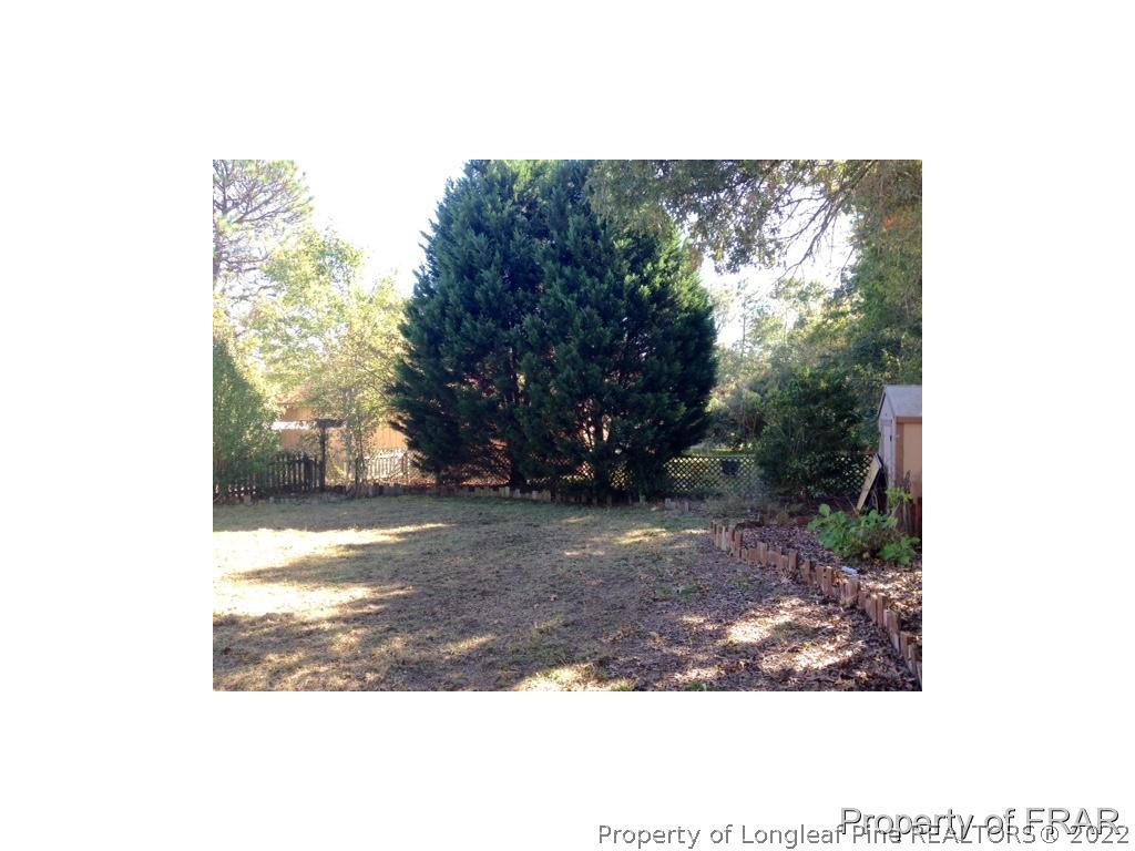 1786 Arrow Ridge Way Fayetteville, NC 28304 - Photo 15 of 17 a view of a yard with plants and trees