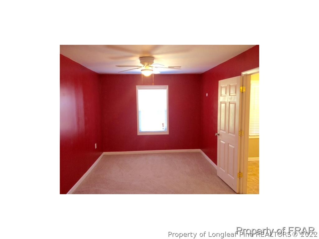 1786 Arrow Ridge Way Fayetteville, NC 28304 - Photo 6 of 17 a view of an empty room with a window