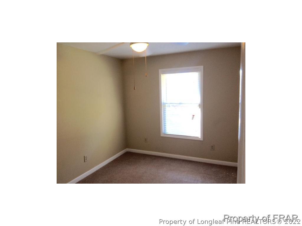 1786 Arrow Ridge Way Fayetteville, NC 28304 - Photo 8 of 17 a view of an empty room with a window