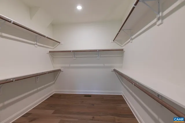 a workspace with wooden floor and closet