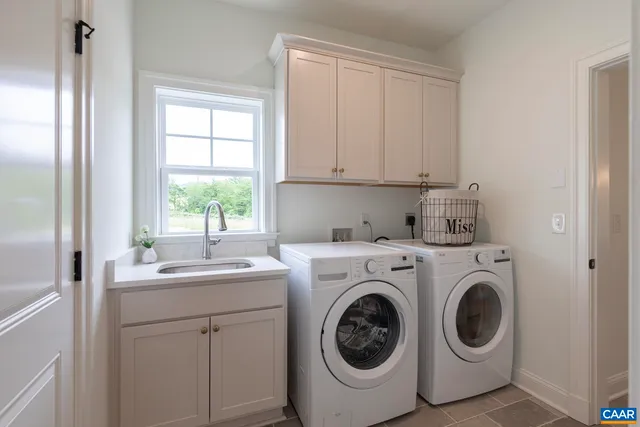 a view of a dining room with furniture a chandelier and wooden floor