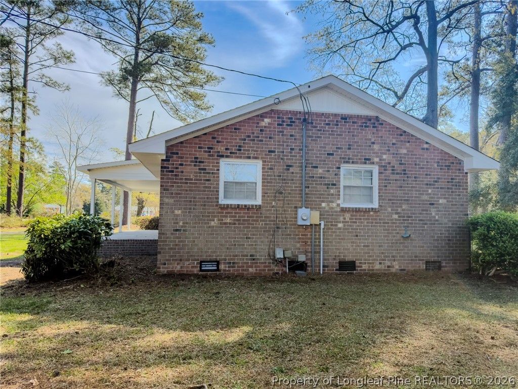 598 Forest Road Lumberton, NC 28358 - Photo 21 of 25 a front view of a house with garden