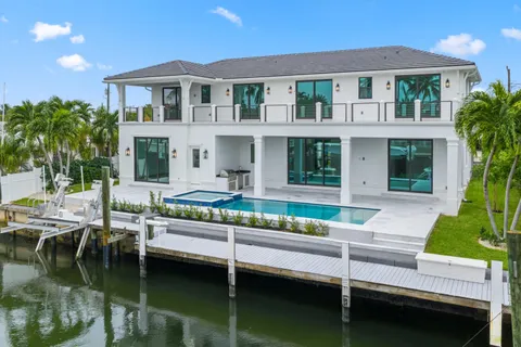 a house with river in front of it