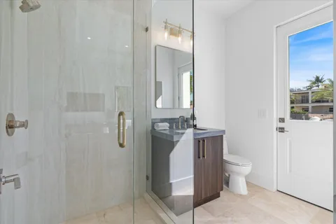 a bed room with a bed and a large window