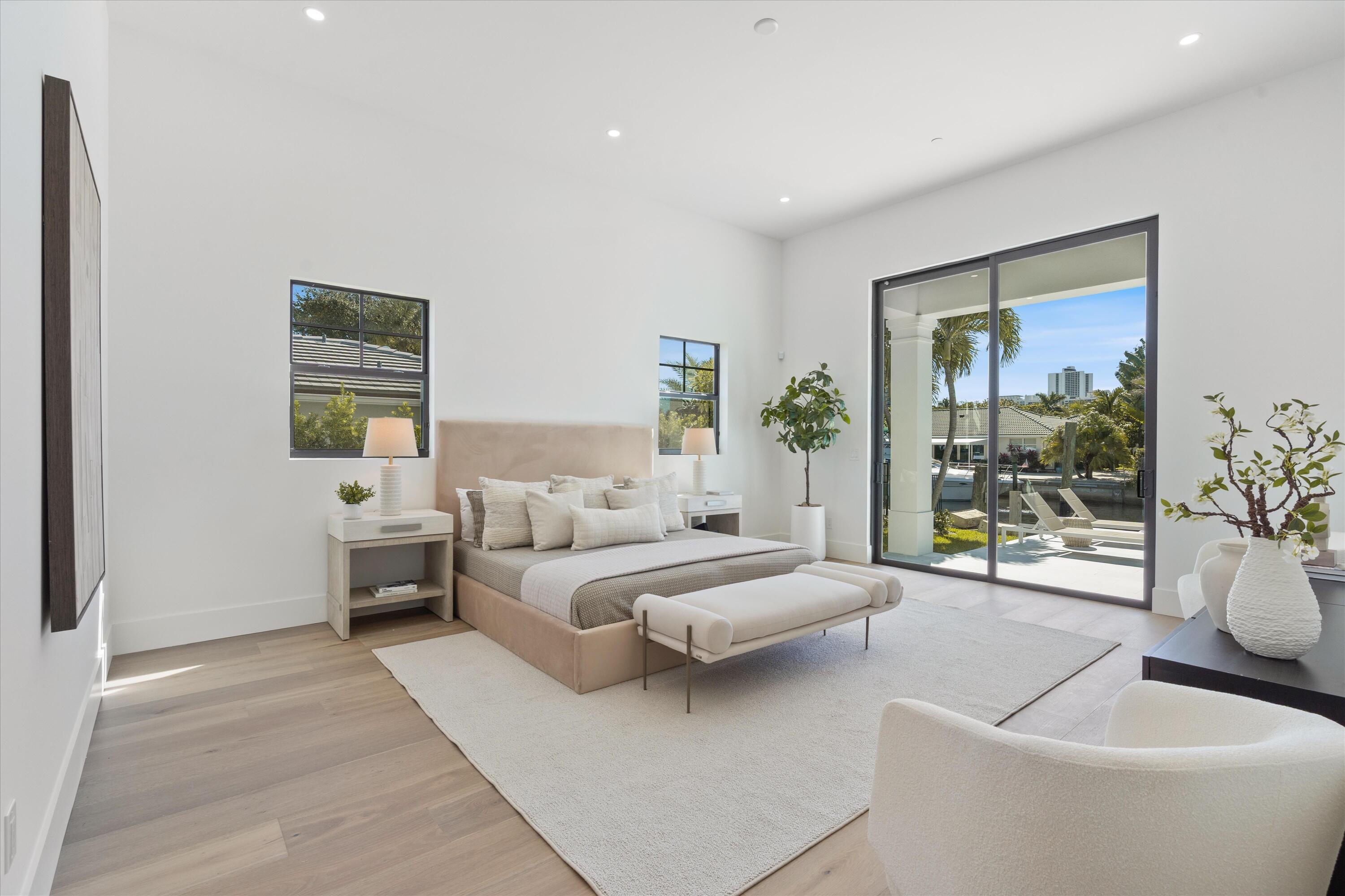 1211 Gulfstream Way Singer Island, FL 33404 - Photo 18 of 54 a bed room with a bed and a large window