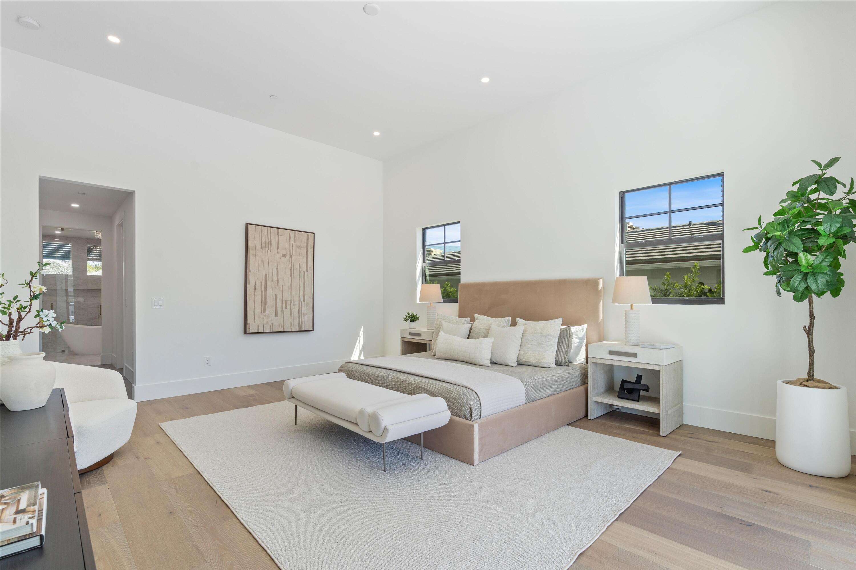1211 Gulfstream Way Singer Island, FL 33404 - Photo 21 of 54 a living room with furniture a potted plant and a lamp
