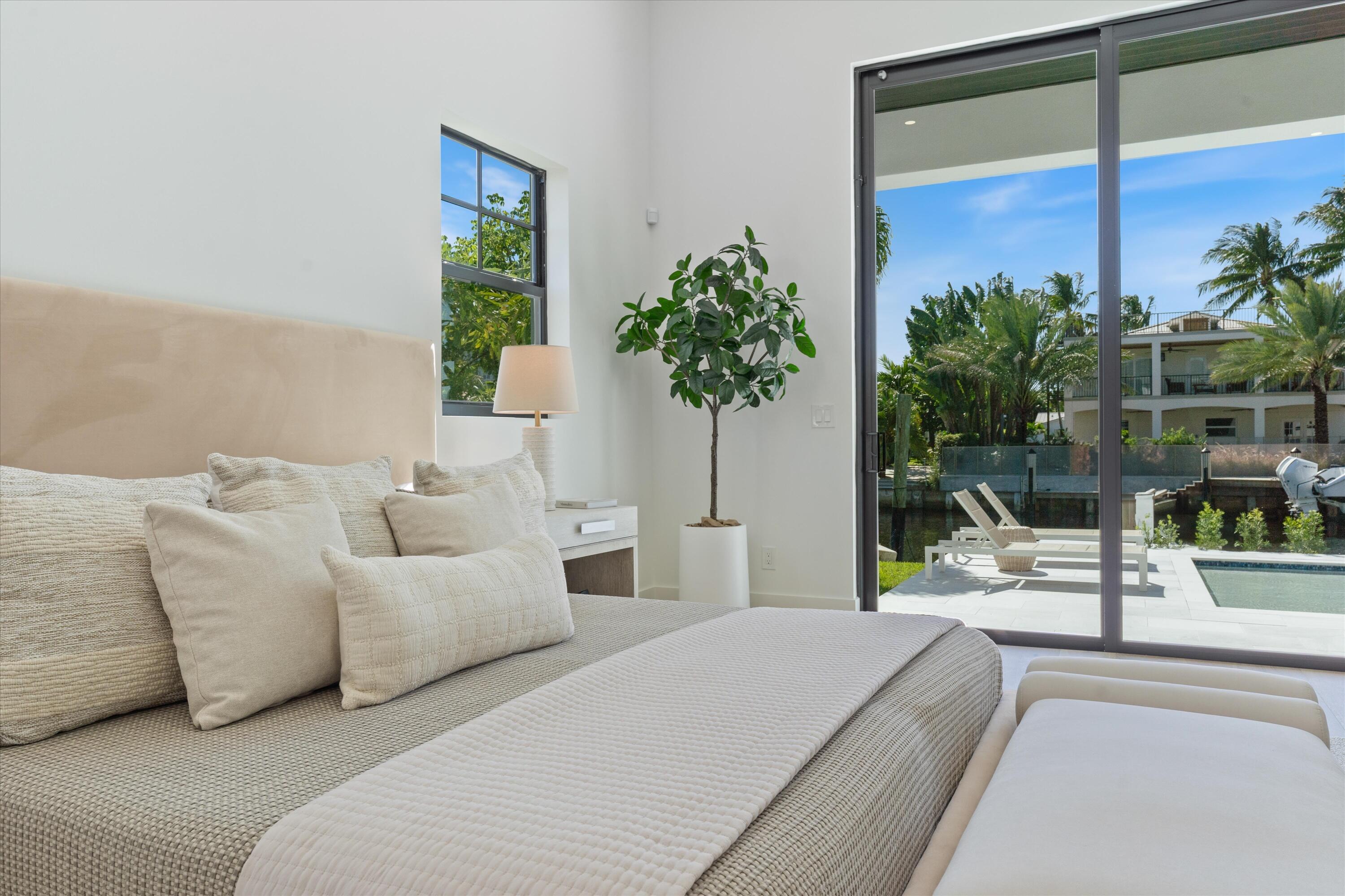 1211 Gulfstream Way Singer Island, FL 33404 - Photo 22 of 54 a living room with furniture and a potted plant