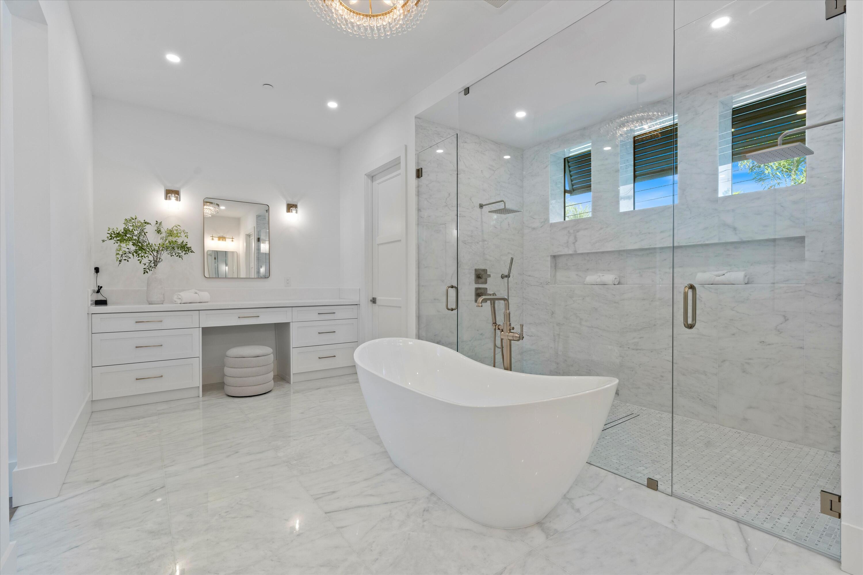 1211 Gulfstream Way Singer Island, FL 33404 - Photo 25 of 54 a spacious bathroom with a bathtub and shower