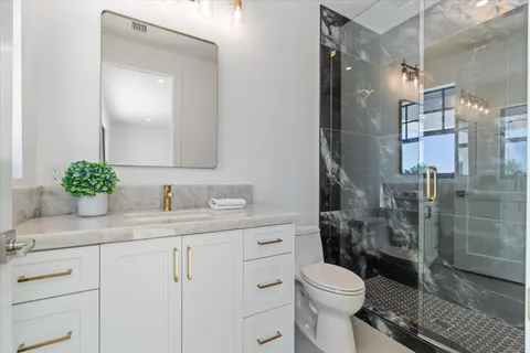 a bedroom with a bed and a couch