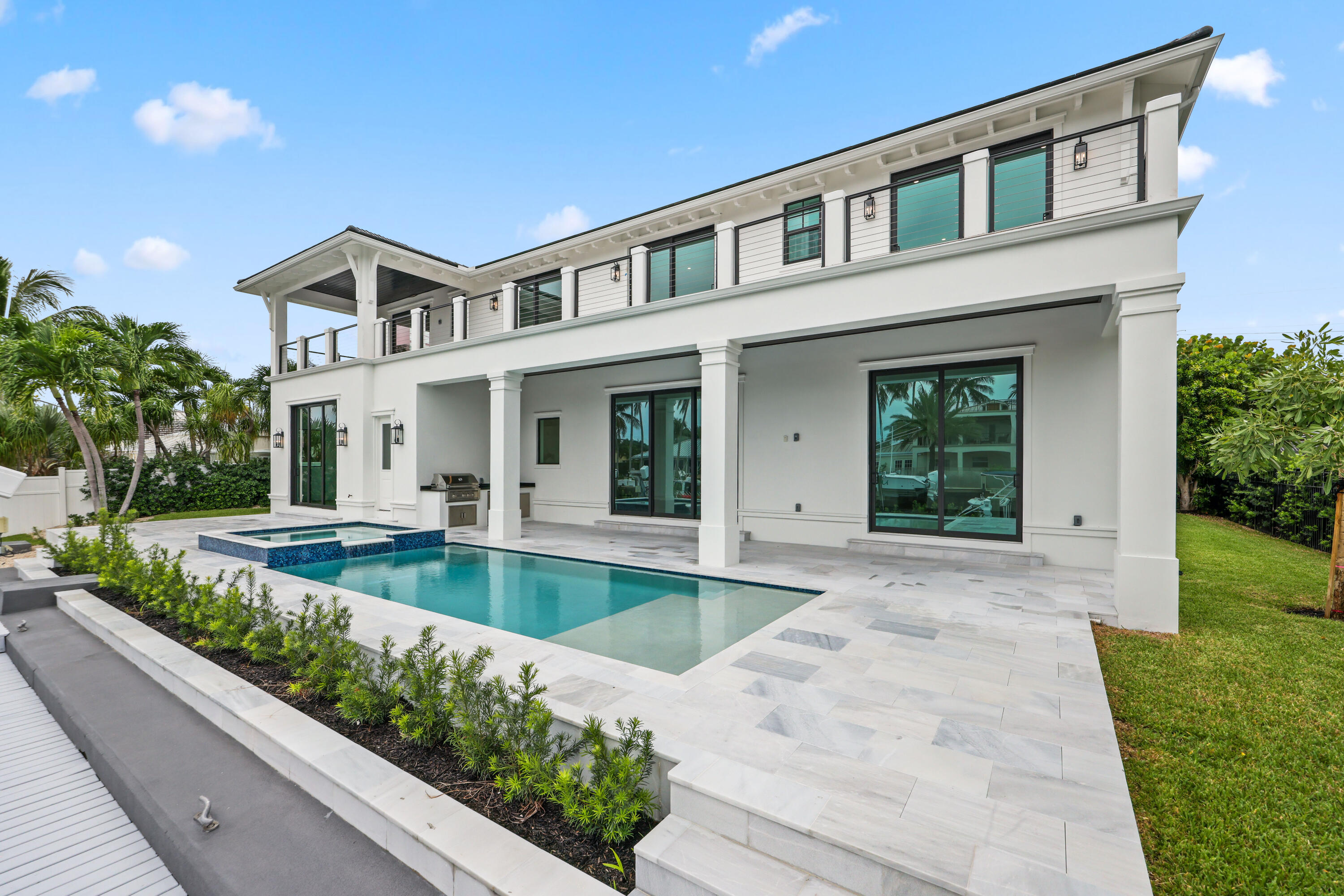 1211 Gulfstream Way Singer Island, FL 33404 - Photo 46 of 54 a view of a house with swimming pool and yard
