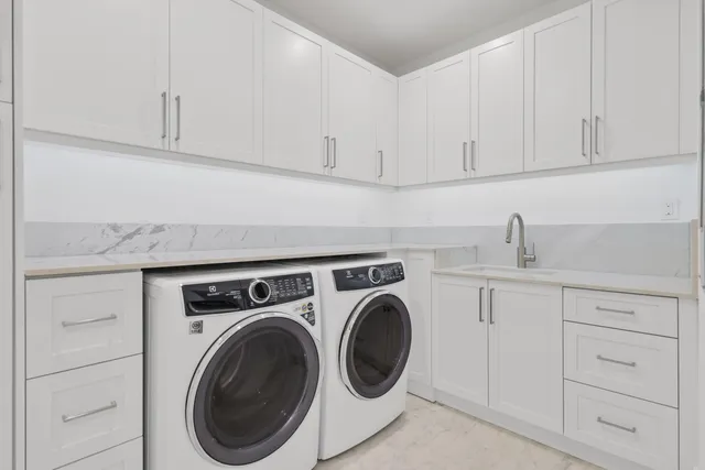 a aerial view of a house next to a yard