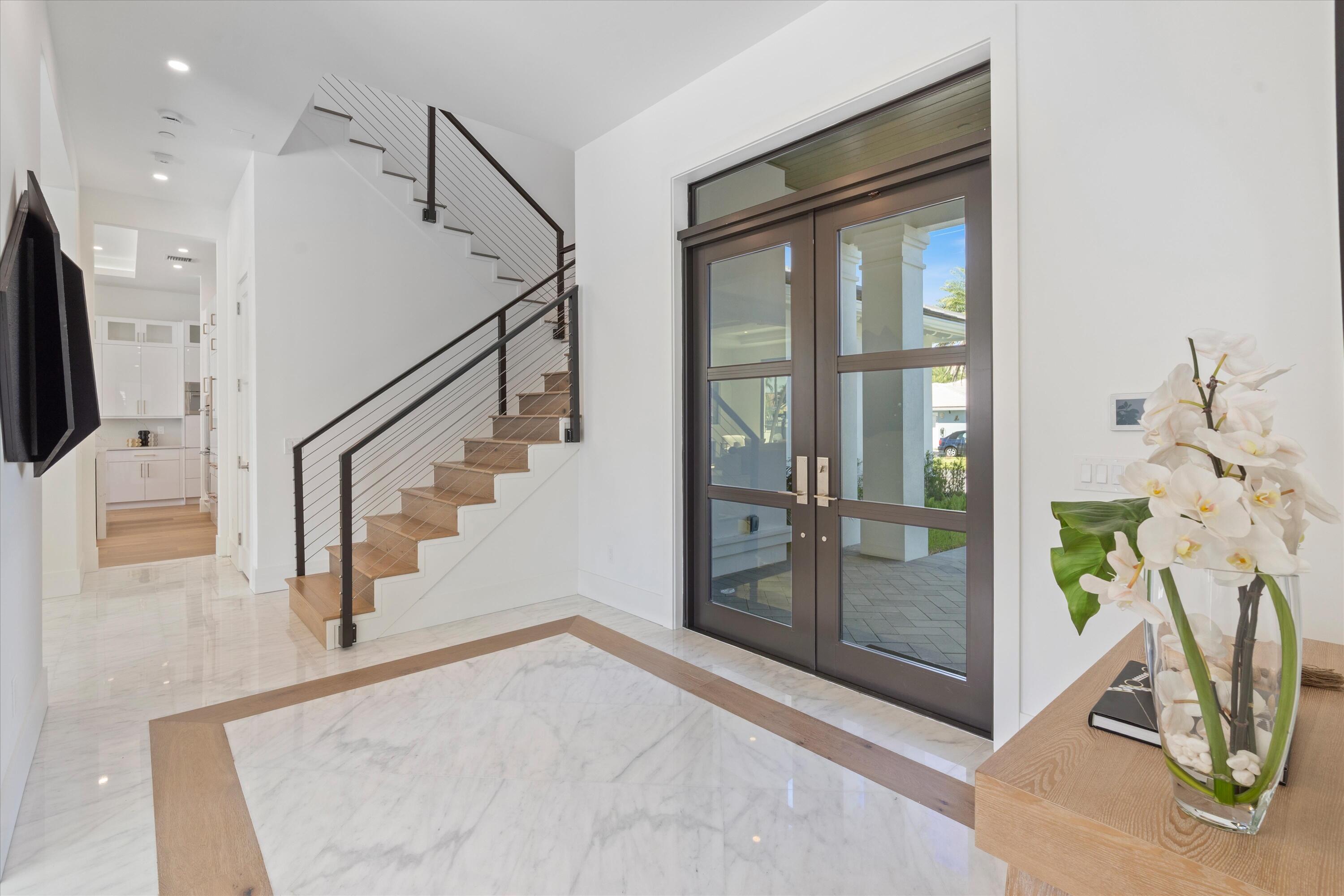 1211 Gulfstream Way Singer Island, FL 33404 - Photo 6 of 54 a view of entryway and hall