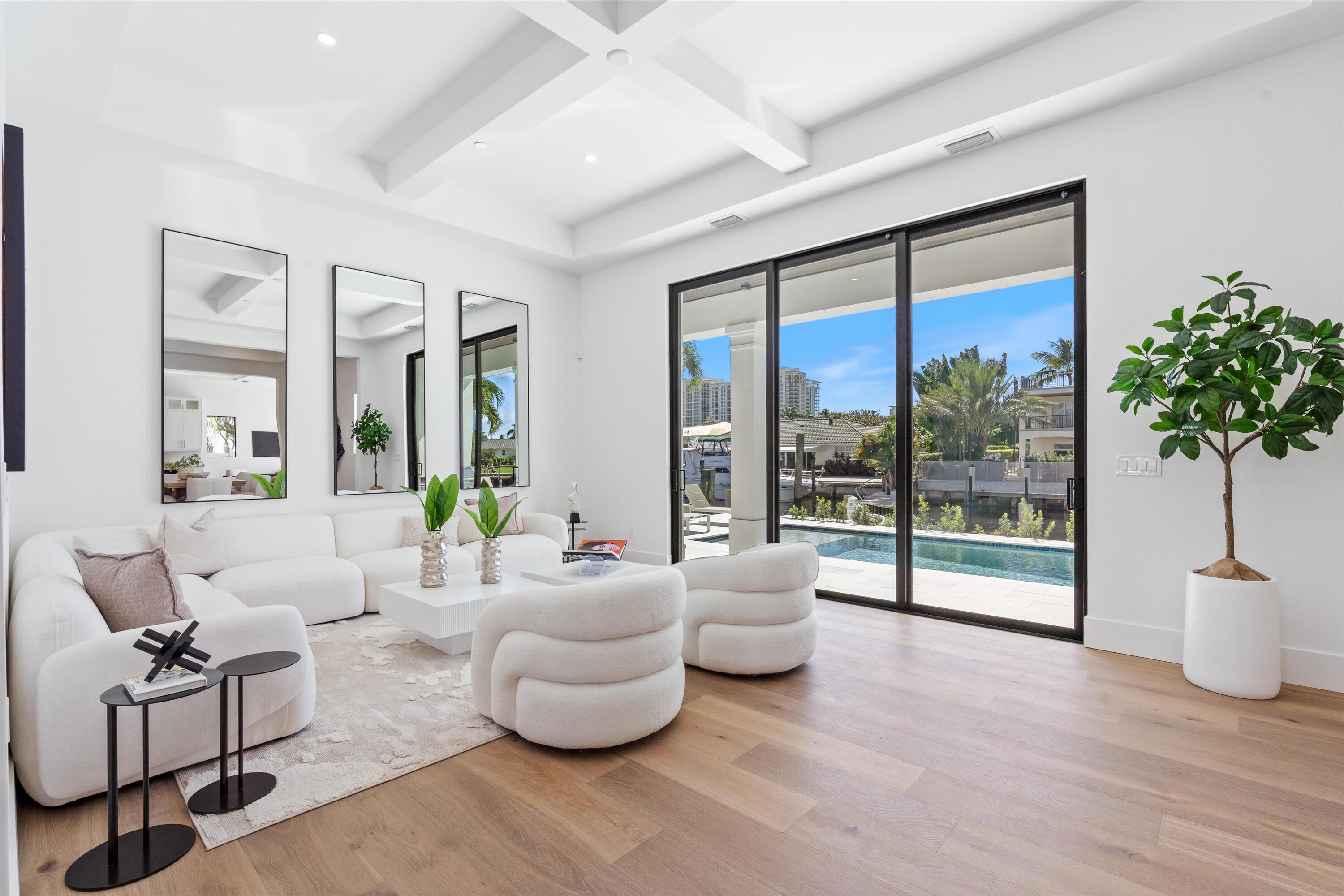 1211 Gulfstream Way Singer Island, FL 33404 - Photo 7 of 54 a living room with furniture and a large window with outer view