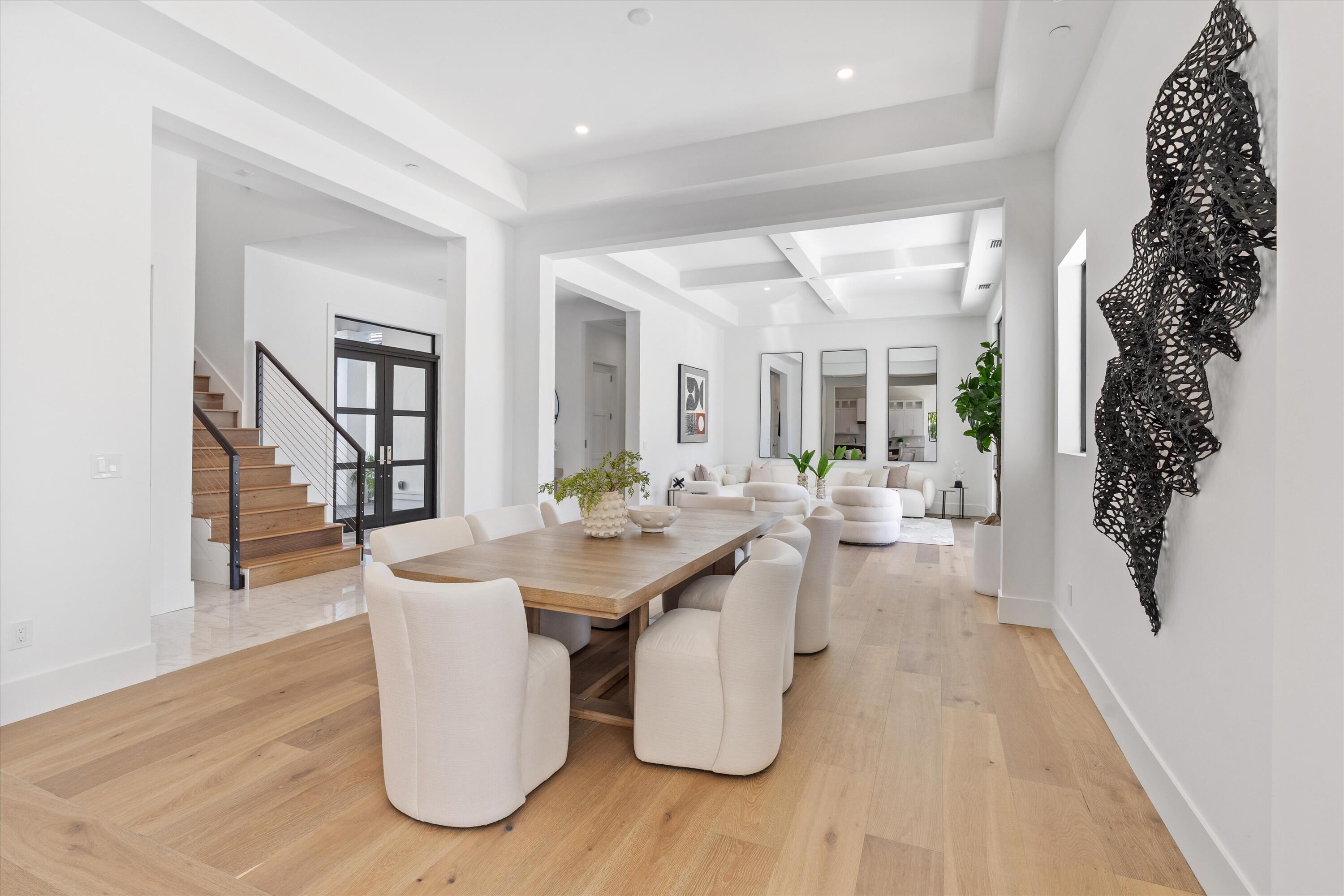 1211 Gulfstream Way Singer Island, FL 33404 - Photo 9 of 54 a view of a dining room with furniture window and wooden floor
