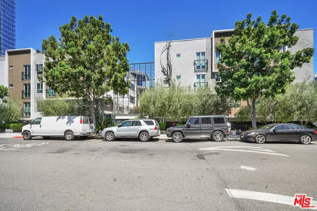 a view of a street with cars