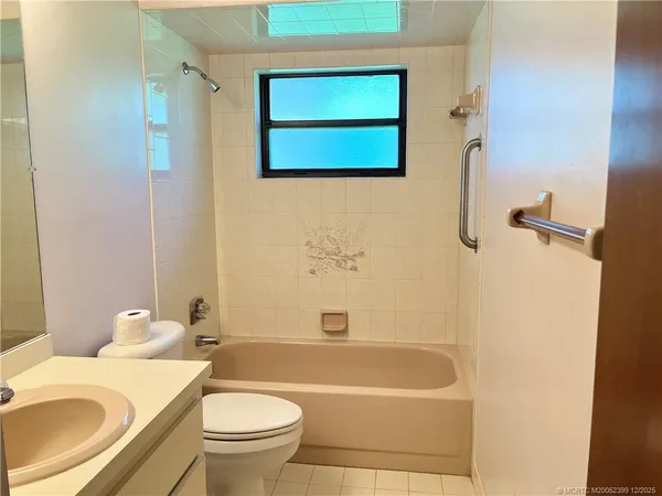 a bathroom with a sink a toilet and a bathtub