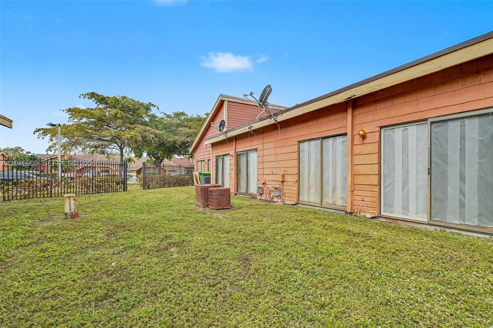 5510 Northwest 24th Street Lauderhill, FL 33313 - Photo 23 of 25 a house view with a garden space