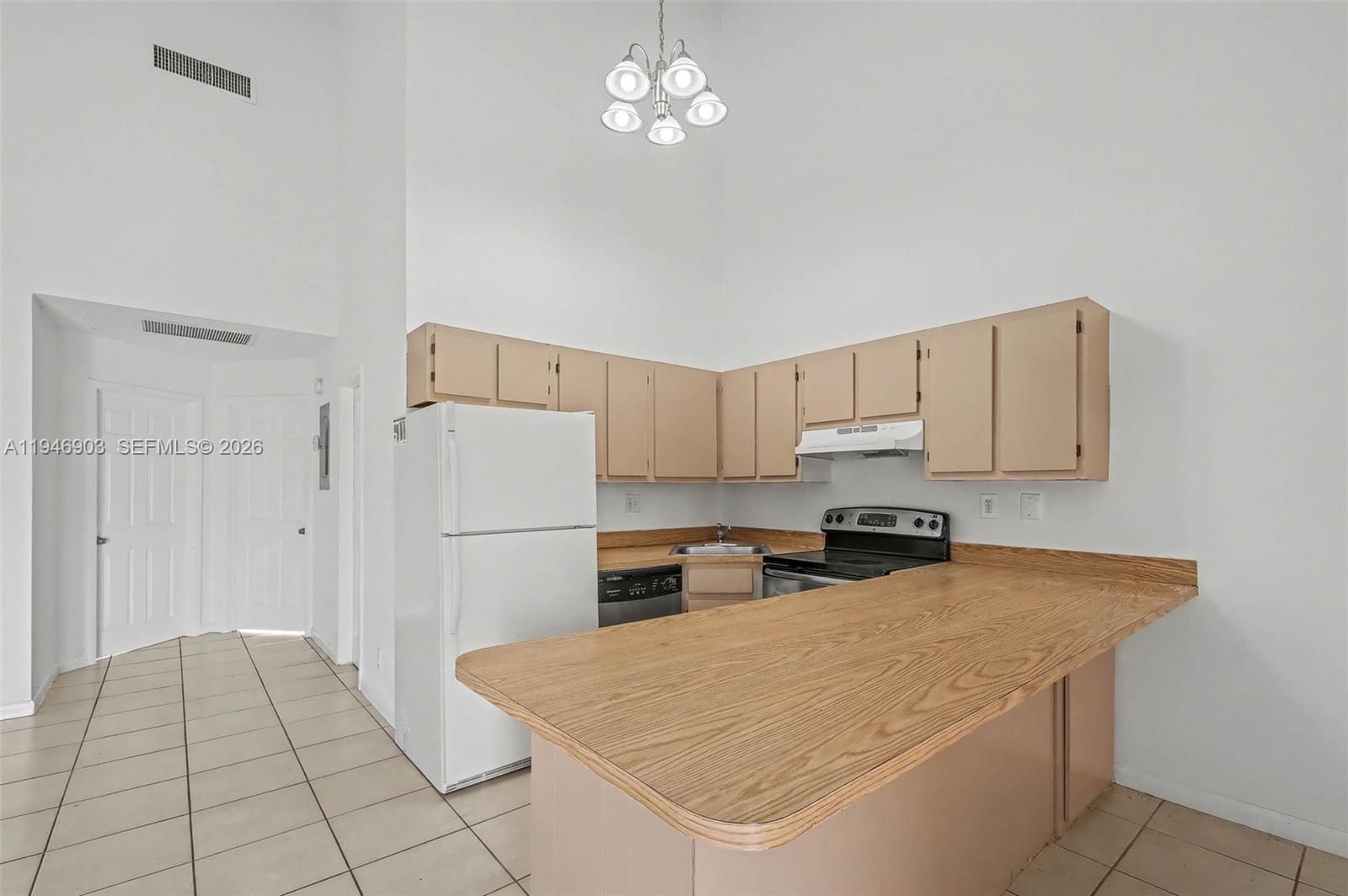 5510 Northwest 24th Street Lauderhill, FL 33313 - Photo 9 of 25 a kitchen with a cabinets appliances and a counter space
