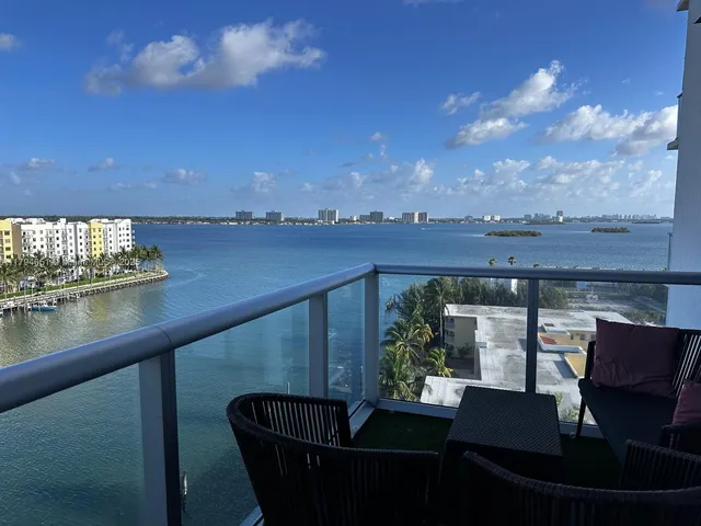 a view of balcony with furniture