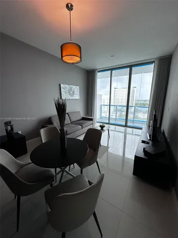 a view of a dining room with furniture window and outside view