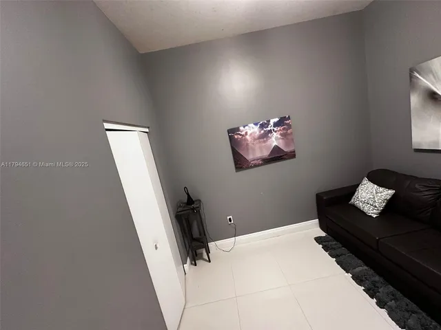 a bedroom with bed and a window