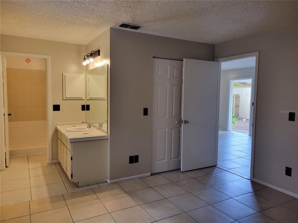 3133 Huron Avenue Oldsmar, FL 34677 - Photo 20 of 43 a bathroom with a sink a mirror and a bathtub
