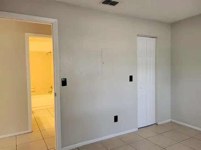 a white toilet sitting next to a bath tub