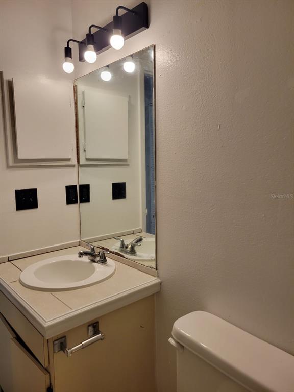 3133 Huron Avenue Oldsmar, FL 34677 - Photo 28 of 43 a bathroom with a sink and a toilet