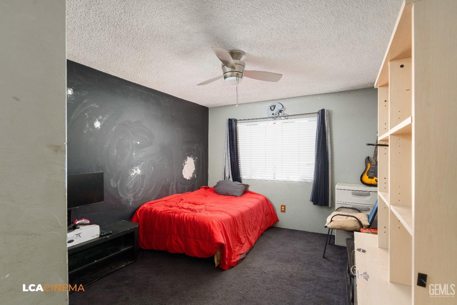 Undisclosed Address Bakersfield, CA 93306 - Photo 14 of 34 a bedroom with a bed and window