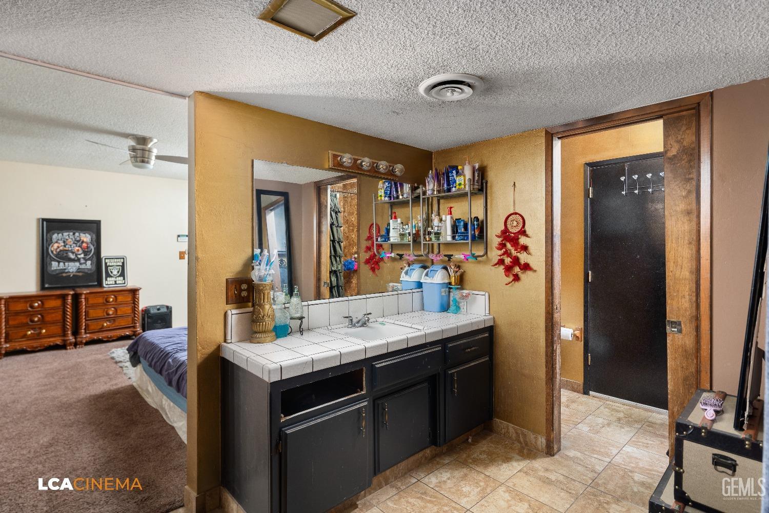 Undisclosed Address Bakersfield, CA 93306 - Photo 16 of 34 a bathroom with a sink double vanity and a mirror