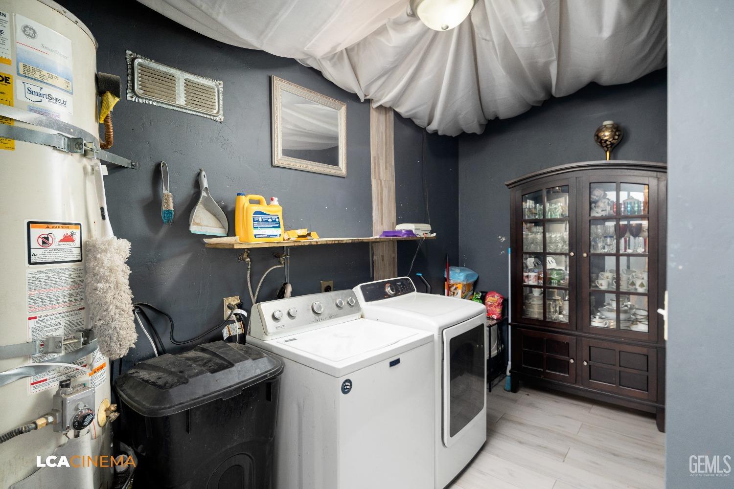 Undisclosed Address Bakersfield, CA 93306 - Photo 18 of 34 a utility room with dryer and washer
