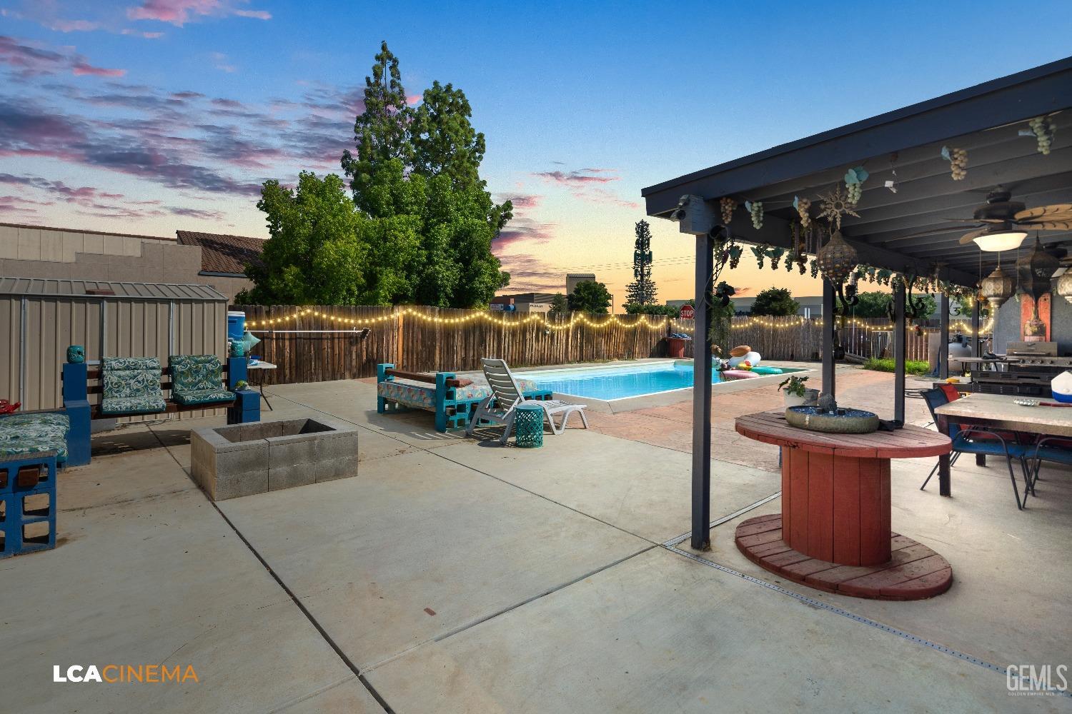 Undisclosed Address Bakersfield, CA 93306 - Photo 19 of 34 a view of a patio with table and chairs potted plants with wooden floor