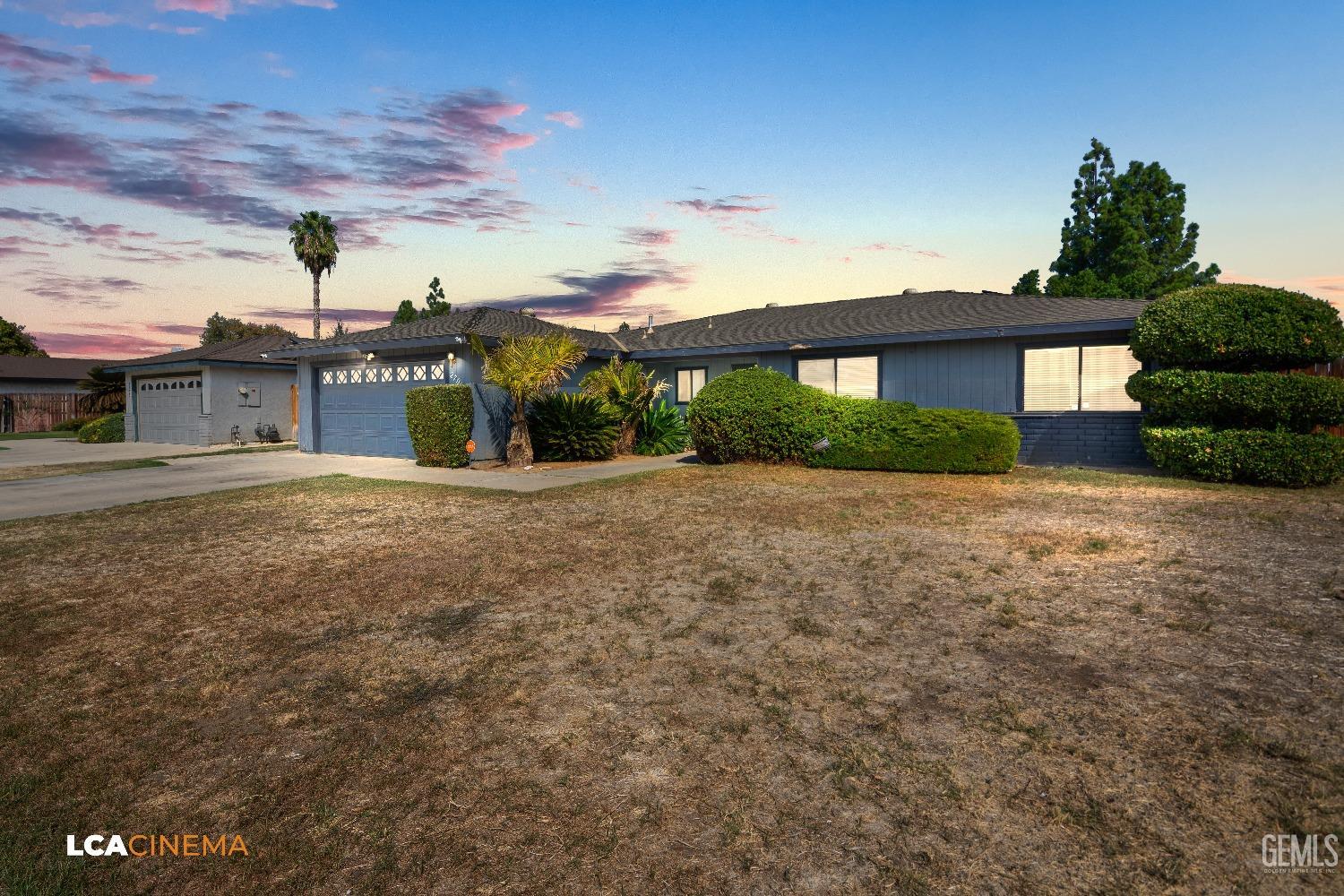 Undisclosed Address Bakersfield, CA 93306 - Photo 2 of 34 a front view of a house with a yard