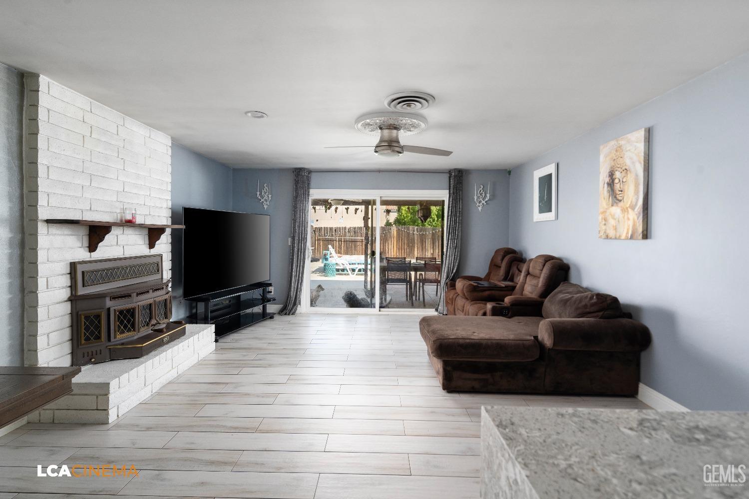 Undisclosed Address Bakersfield, CA 93306 - Photo 4 of 34 a living room with furniture and a flat screen tv