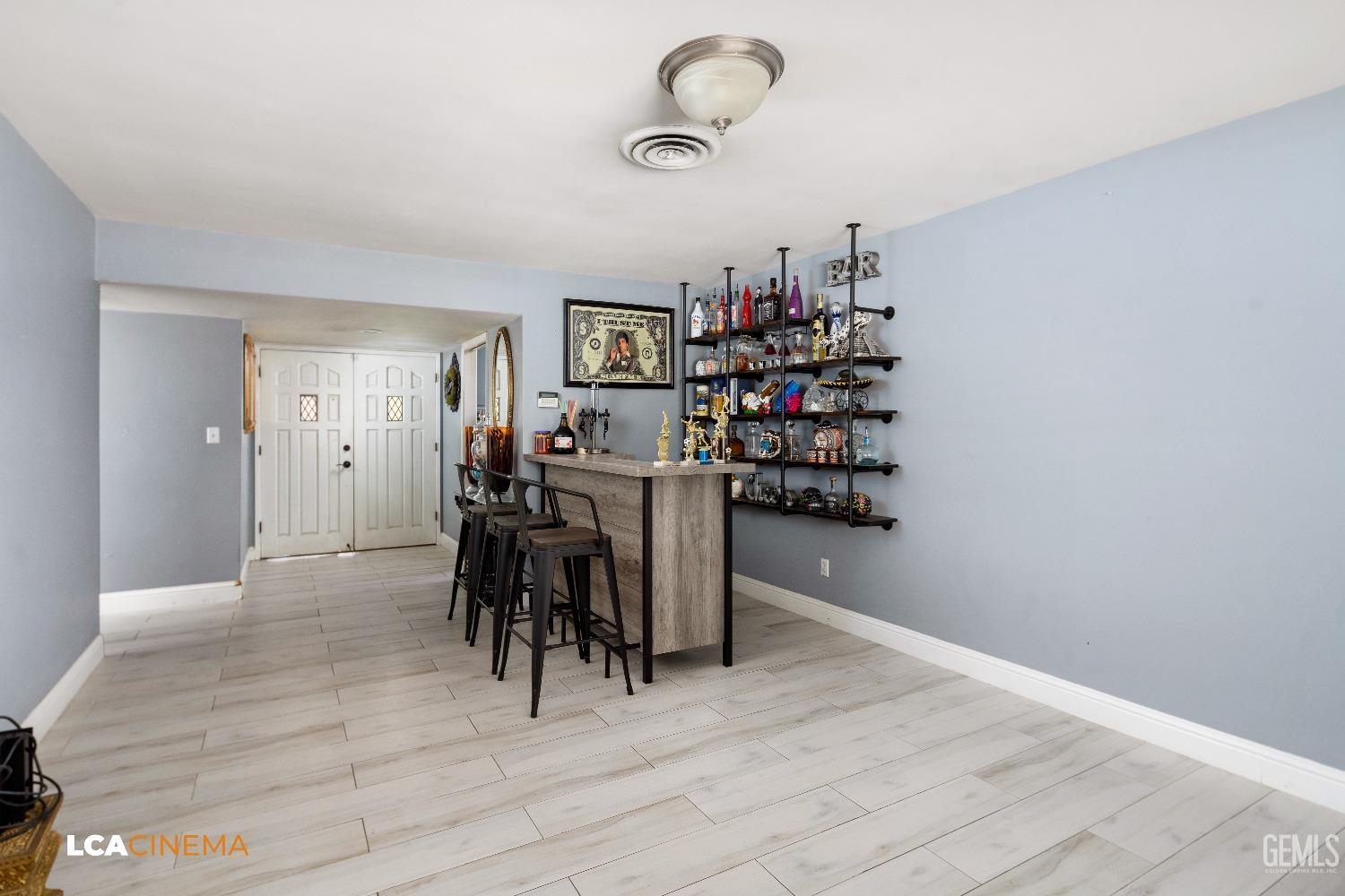 Undisclosed Address Bakersfield, CA 93306 - Photo 7 of 34 a view of a dining room with furniture and wooden floor