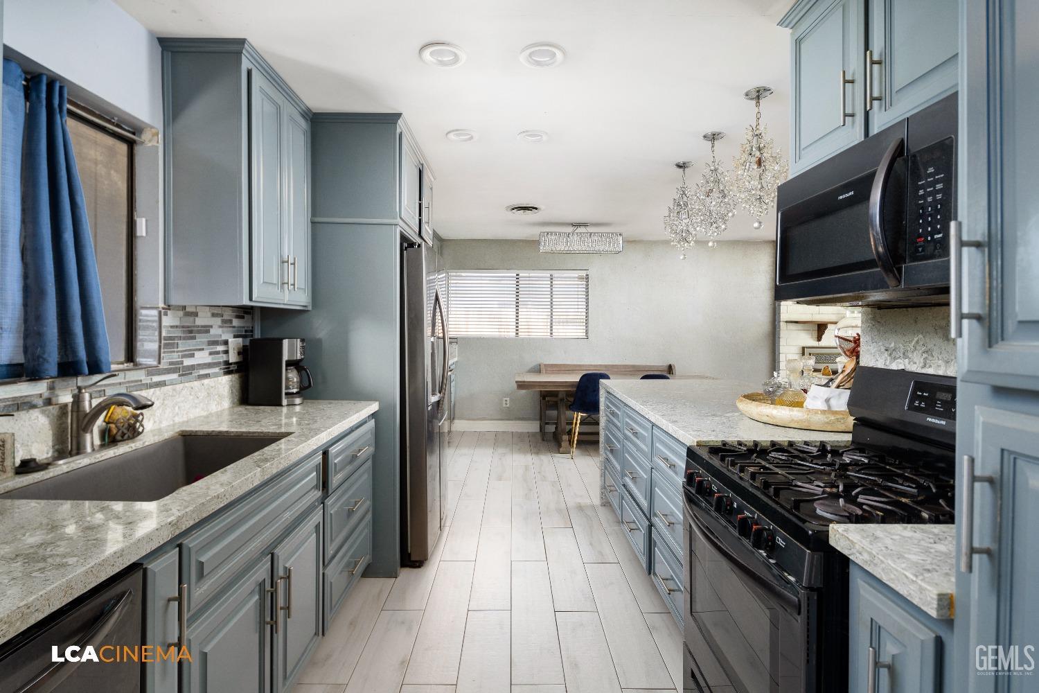 Undisclosed Address Bakersfield, CA 93306 - Photo 8 of 34 a kitchen with stainless steel appliances granite countertop a sink stove and refrigerator