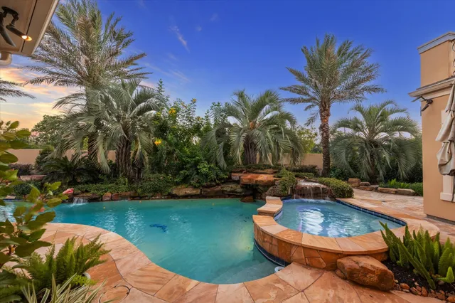an aerial view of a house with outdoor space lake view and lake view