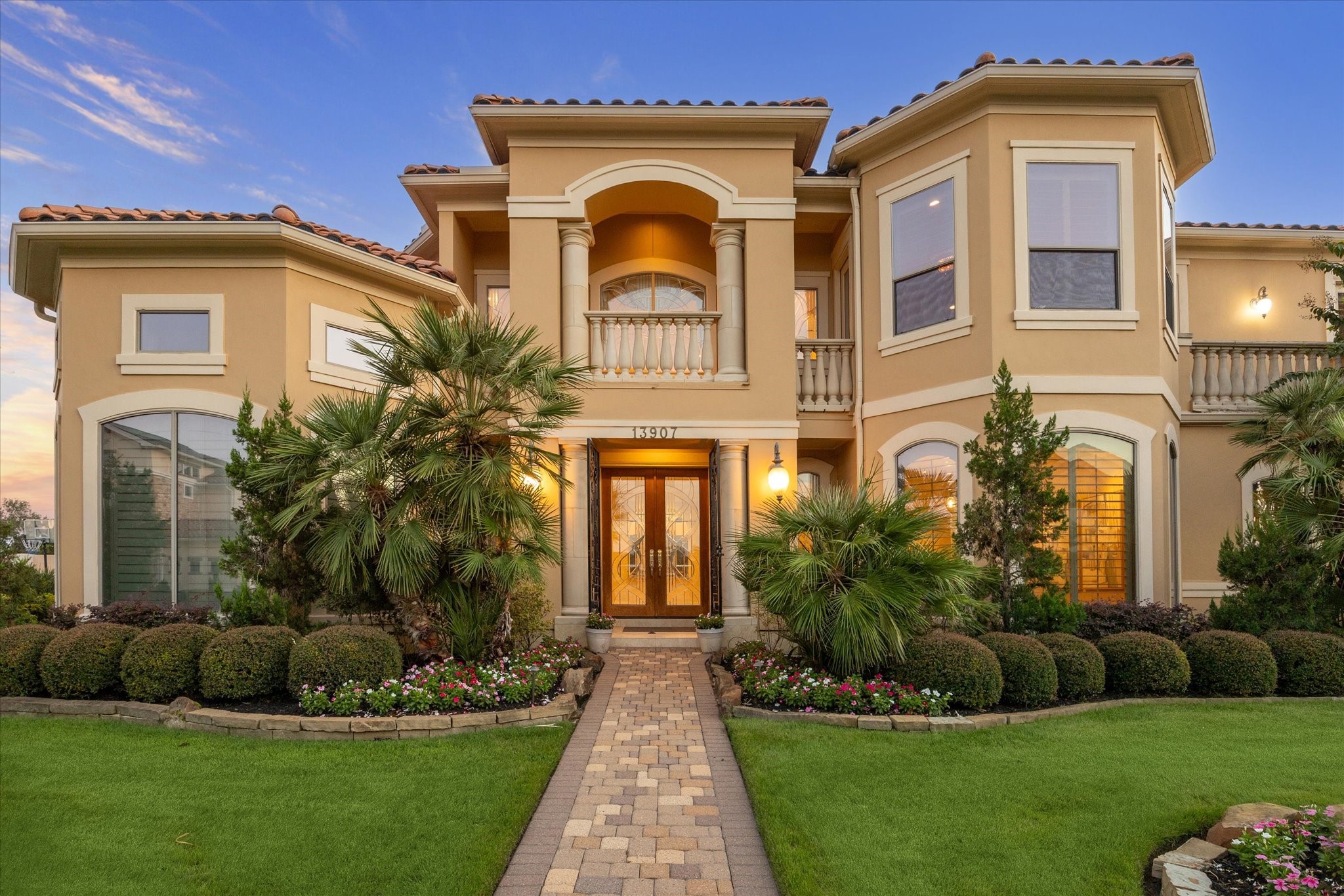 13907 Slate Creek Lane Houston, TX 77077 - Photo 29 of 29 a front view of a house with a garden