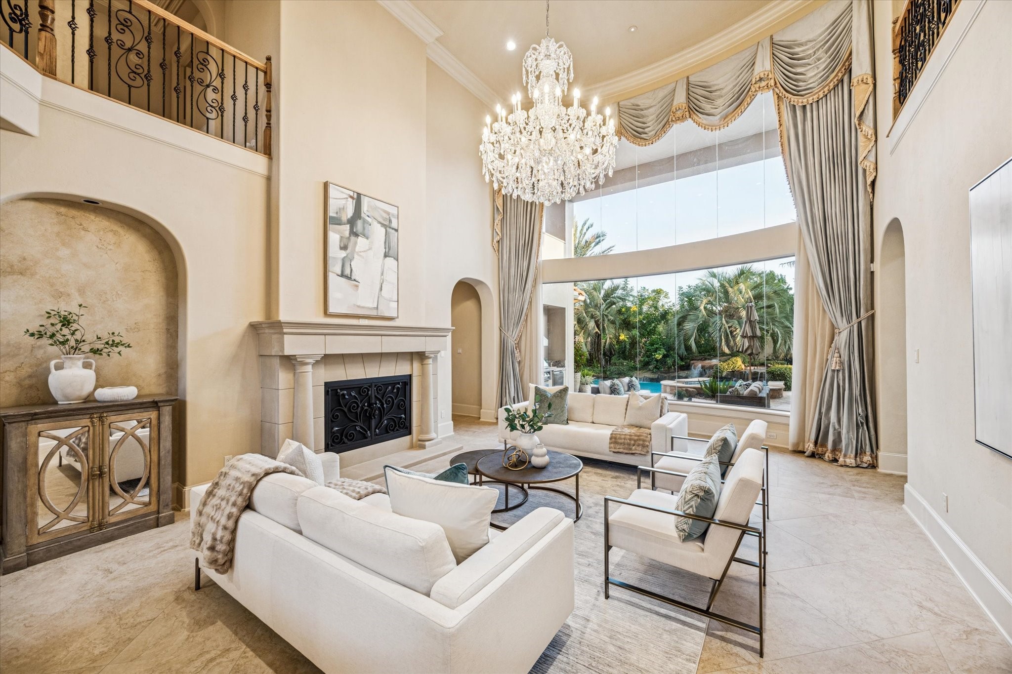13907 Slate Creek Lane Houston, TX 77077 - Photo 4 of 29 a living room with furniture a fireplace and a chandelier