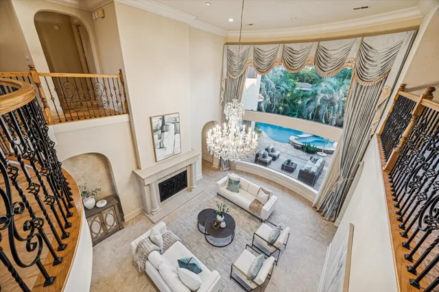 a view of living room with furniture and a floor to ceiling window